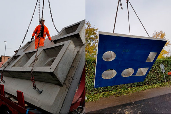 Pose de produits en béton pour les égouts.